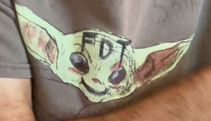t-shirt with Star Wars figure with hand written F.D.T. on its face